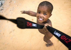 Camera Thief Everything is a game. I wanted to take a photo. This little boy wanted to be swung around.