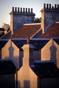 Chimneys Architectural photography can benefit hugely from being able to wait for the right light. Unlike an object in a studio, you can't just move lights around. Often you can plan when to take the photo though. If it is impractical to visit the building a site in advance, tools like Google Earth can help greatly in predicting how the light will fall on your subject at a given time of day and season. Sometimes you just have to wait. That wasn't an issue with this image as it was the view from my studio window in Surry Hills. I waited until the shadows of the chimneys were perfectly placed on the gables of the terraced buildings. Moments later this spectacular light was gone.