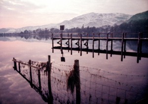 Cloud Lake Coniston Water, a five mile long lake in England's Lake District is known for it's beautifully calm water. For this reason it was the site of numerous wold water speed records, starting in 1939 by Sir Malcolm Campbell and continuing into the 1960s by his son, Donald. Tragically, Donald Campbell was killed in 1967 while attempting a speed of over over 300 mph. He achieved a return, unrecorded pass of 320 mph just before the fatal crash. This peaceful looking lake is steeped in dark history.