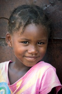 Girl in Pink The children of the river communities in South-Western Namibia were noticeably shyer than the bushman kids in other parts of the country. Still, this little girl was happy to pose for a portrait.