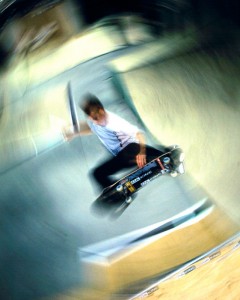 Ramp Twist I was to photograph this skater for a magazine ad. On the day it was raining so the outdoor park was out of the question. We had to shoot in a converted factory. Although it was a great place for skaters, the scenery wasn't great. I needed to make it go away. I knew blur was a solution but normal pan blur wouldn't suit the subject. I came up with the idea of twisting the camera in the opposite direction of the skater's top turn to exaggerate his motion and disguise the dull background. The flash froze the skater. I was really pleased with the result and flattered years later when a surf photographer told me that that particular ad had started a trend in twist blur in surf and skate photography. It pays to experiment.