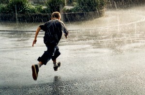 Run for it I was with a group of people sheltering in a shop doorway during a torrential downpour. This boy decided to make a run for it. I took this photo as he set off.