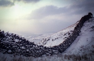 Snow Wall Dry stone wall in the snow of Cumbria's Lake District in Northern England.
