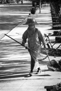 Sweeper Woman sweeping the streets of Koh Samui, Thailand, 1985