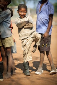 One Boot One Boot. An unusual way to get the photographer's attention. He had the other boot, just not when he wanted me to take his picture. Hai//com Village, Kalahari Desert, Namibia.