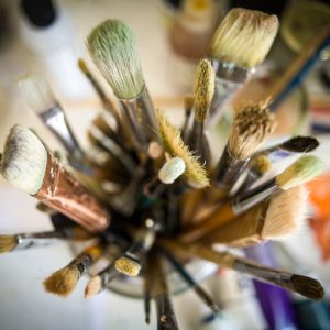 A collection of artist's brushes from above.